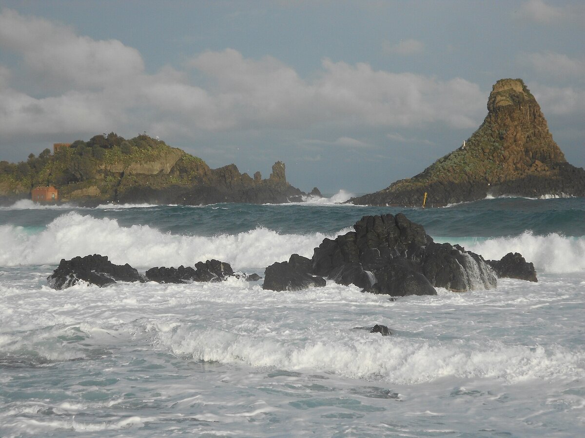 The Faraglioni dei Ciclopi rock stacks off Aci Trezza