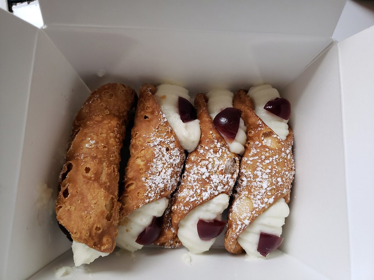 Sicilian cannoli filled with fresh ricotta